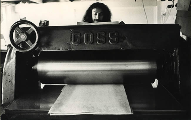 Michael Felber printing an etching on his press 1974